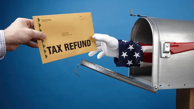 A PERSON RECEIVING THEIR TAX REFUND IN THE MAIL. 