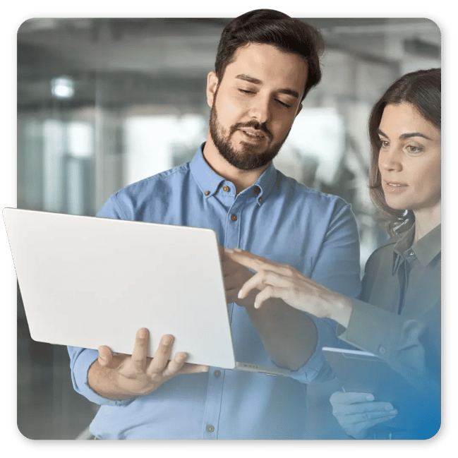 Man adn woman working on a desktop