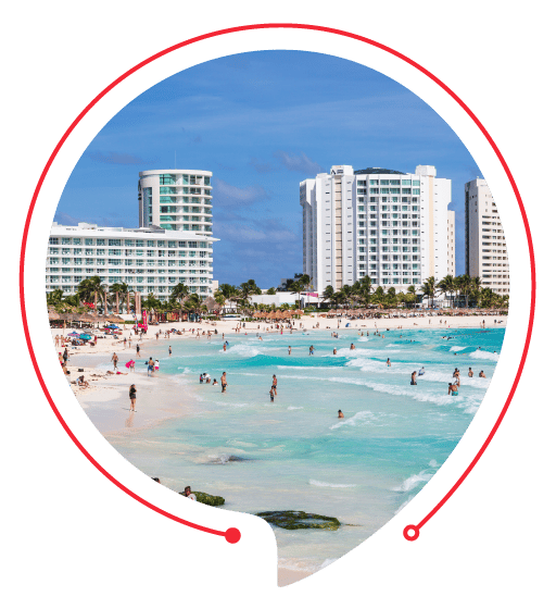 Luxury hotel buildings overlooking a pristine beach in Mexico, representing H&CO’s seamless solutions for businesses expanding into the Mexican market, doing business in Mexico.