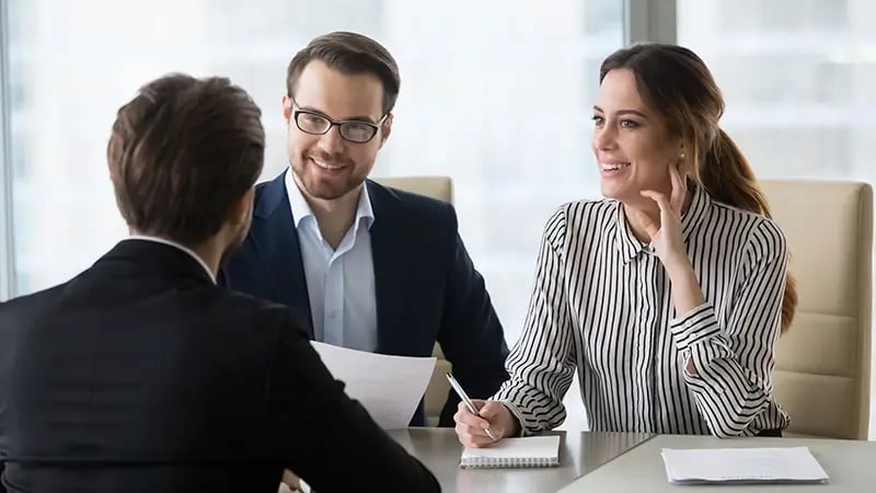A candidate responding to a job interview with two recruiters