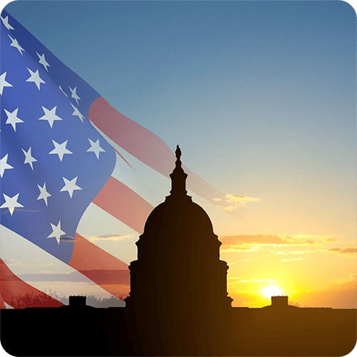 La bandera de EE. UU. y el edificio del Capitolio de EE. UU. que representan a inversores extranjeros y empresas multinacionales navegan por las leyes fiscales de EE. UU.