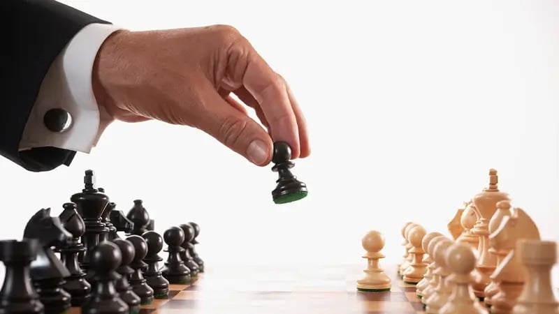 A chess game illustrating international tax planning strategies.