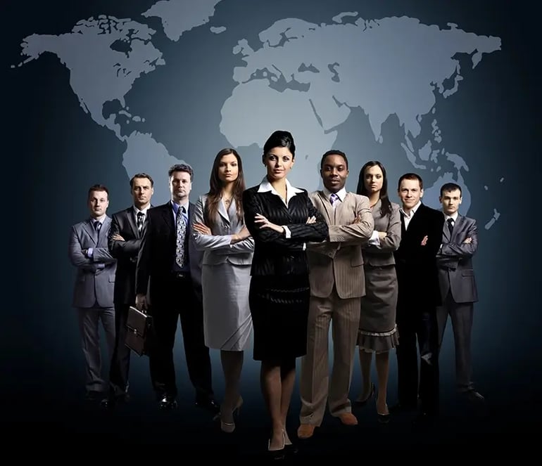 A TEAM OF PEOPLE IN SUITS STANDING IN FRONT OF A WORLD MAP, READY TO TAKE ON GLOBAL TAX COMPLIANCE. 