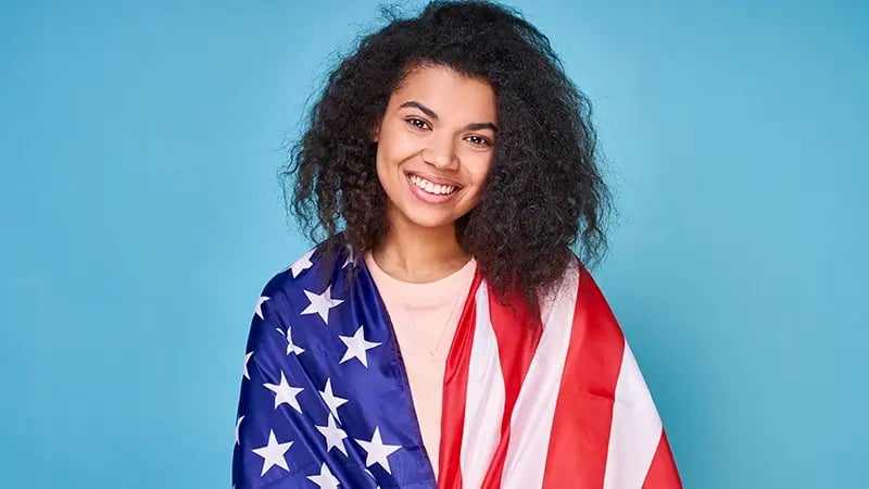 expatriate woman with USA flag
