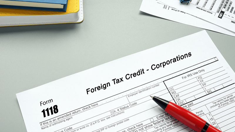 Form 1118 sheet on a desk to be completed